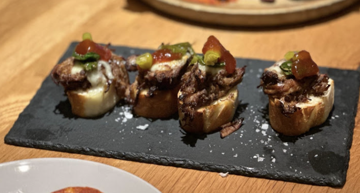Bulla Gastrobar Plano signature dishes MontaditosPatatas BravasPaella